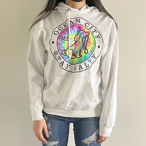 White hoodie with a tied dye print on it